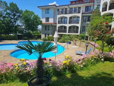 a resort with a swimming pool and a building at DELFIN Penthouse amazing view in Sveti Vlas