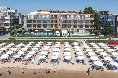 an aerial view of a beach with umbrellas and people at JOY Studio in Ravda