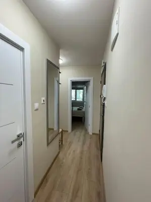 an empty room with a hallway with a mirror at Comfy home 2 - Burgas Centre in Burgas City