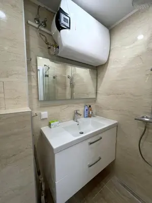 a bathroom with a white sink and a mirror at Comfy home 2 - Burgas Centre in Burgas City
