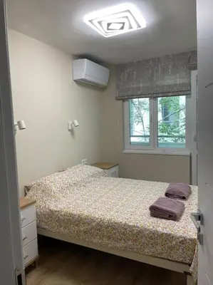a bedroom with a bed and a window at Comfy home 2 - Burgas Centre in Burgas City