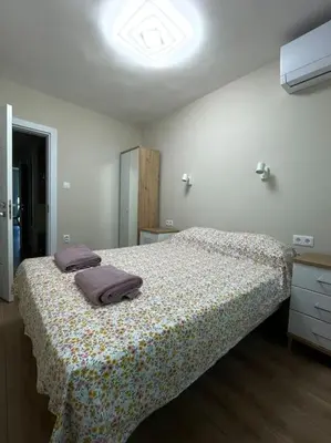 a bedroom with a bed with two pillows on it at Comfy home 2 - Burgas Centre in Burgas City