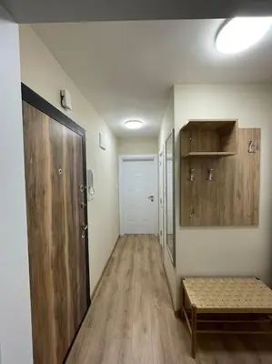 a hallway with a door and a bench in a room at Comfy home 2 - Burgas Centre in Burgas City