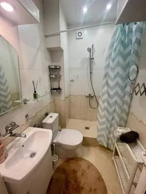 a bathroom with a toilet and a sink and a shower at Varna city Park Apartament in Varna City