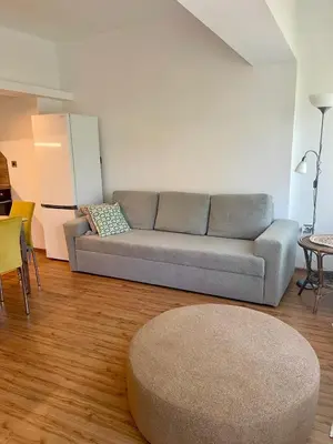 a living room with a couch and a table at Varna city Park Apartament in Varna City