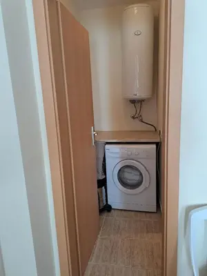a laundry room with a washer and dryer at Lidda Relax in Oasis Beach Kamchia in Bliznatsi