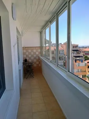 a balcony with windows and a view of a city at Васил Левски 61 in Burgas City