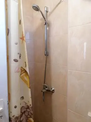 a shower in a bathroom with a glass door at Апартаменти Захариеви 4 in Byala