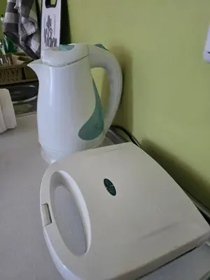 a white vase sitting on top of a toilet at POMORIE Blue Bay in Pomorie
