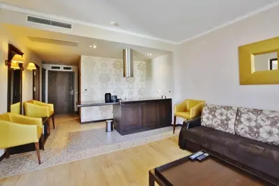 a living room with a couch and a kitchen at Apartment in Royal Beach Barcelo in Sunny Beach