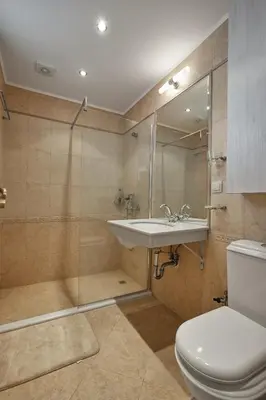 a bathroom with a sink and a shower and a toilet at 2BD Flat with Balcony in Flores Garden Complex by Flat Mаnаger in Chernomorets
