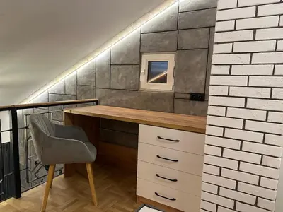 a home office with a desk and a chair at Studio Lazur in Burgas City