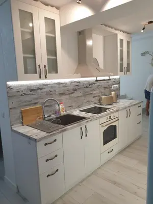 a white kitchen with a sink and a stove at BOHO CHIC STUDIO Free parking upon request in Varna City