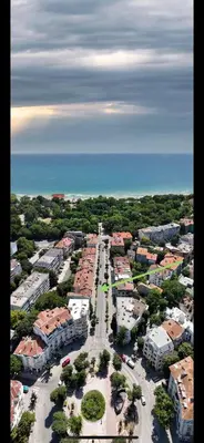 an aerial view of a city with buildings and the ocean at Blue Sea Side Studio in Varna City