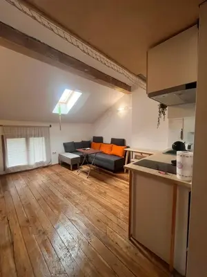 a large living room with a couch and a table at Blue Sea Side Studio in Varna City