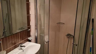 a bathroom with a sink and a shower at Holidays Apartment Atlantis Sarafovo in Burgas City