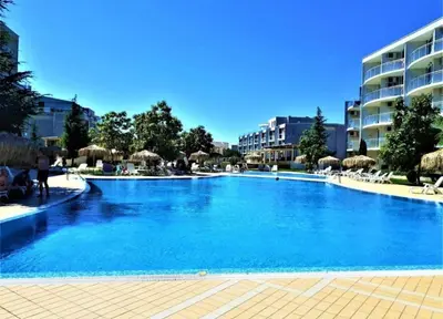 a large blue swimming pool in a resort at Holidays Apartment Atlantis Sarafovo in Burgas City