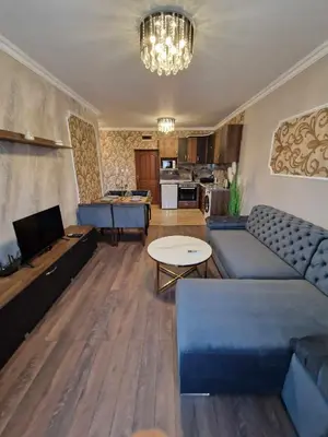 a living room with a couch and a table at MitProt Panorama Bay 2 Luks Apartment 110 in Sveti Vlas