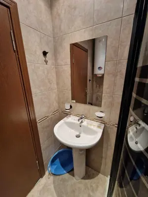 a bathroom with a sink and a mirror at MitProt Panorama Bay 2 Luks Apartment 110 in Sveti Vlas