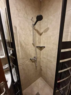 a shower with a shower head in a bathroom at Mit Prot Panorama Bay 2 luks Studio 40 in Sveti Vlas