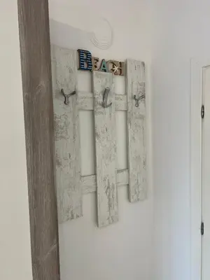 a wall with three windows with birds on it at Tei-Zi apartments2 in Burgas City