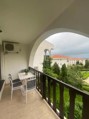 a balcony with a table and chairs and a view at Cozy apartment in Kambani 1 in Sveti Vlas