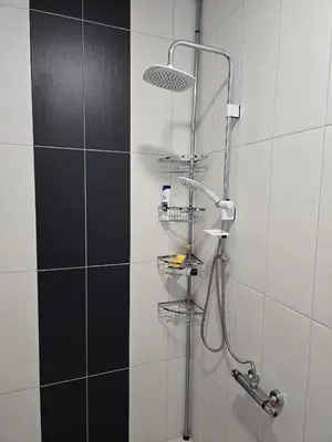 a shower with a shower head in a bathroom at Ах, морето !!! in Tsarevo
