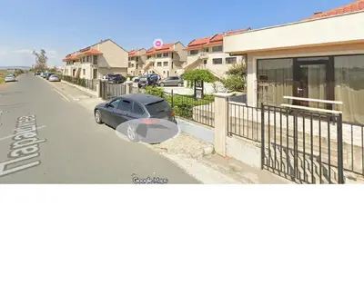 a car parked on the side of a street at Solar Rise apartment in Pomorie