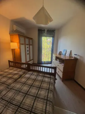 a bedroom with a bed and a desk and a window at Marina Cape Sky View Lux Apartment in Aheloy in Aheloy