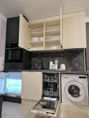 a kitchen with a washing machine and a dishwasher at Polarstar 205A am Meer Sveti Vlas in Sveti Vlas