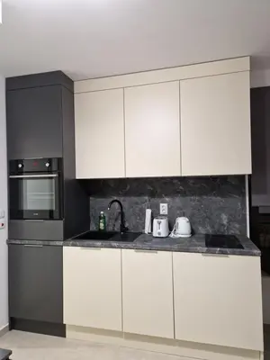 a kitchen with white cabinets and a sink at Polarstar 205A am Meer Sveti Vlas in Sveti Vlas