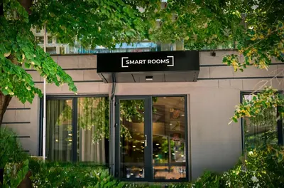 a sign for a smart homes store on the side of a building at Smart Rooms in Varna City