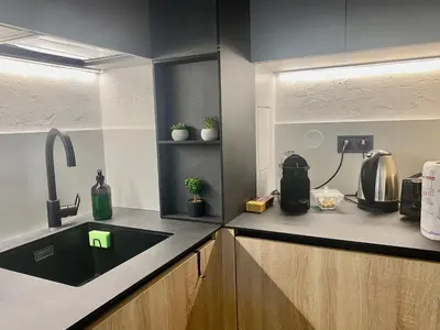 a kitchen with a sink and a counter top at KASHMIR Deluxe apartment with Parking in Burgas City