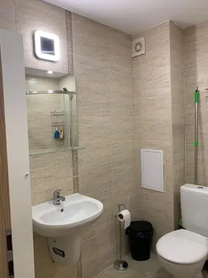 a bathroom with a sink and a toilet at Sunny holidays in Byala