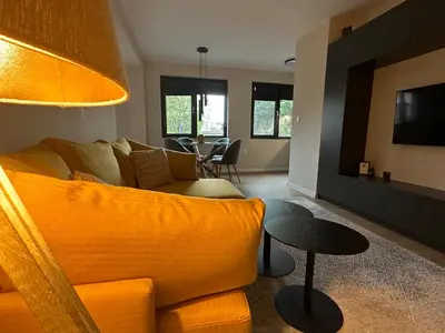 a living room with a couch and a table at Cosy Apartment - Top Location in Burgas City
