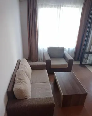 a living room with a couch and a coffee table at Студио Море in Chernomorets