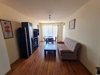 a living room with a couch and a table at MitProt Panorama Bay2 Luks Apartment 174 in Sveti Vlas
