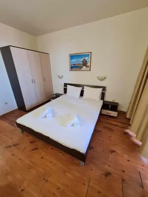 a bedroom with a bed with two towels on it at MitProt Panorama Bay2 Luks Apartment 174 in Sveti Vlas