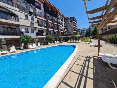 a swimming pool in front of a building at MitProt Panorama Bay2 Luks Apartment 174 in Sveti Vlas