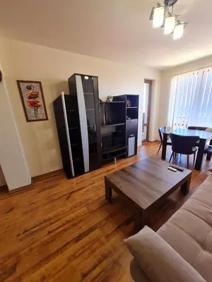 a living room with a couch and a table at MitProt Panorama Bay2 Luks Apartment 174 in Sveti Vlas