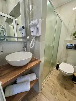 a bathroom with a sink and a shower at Апартамент СВЕТИ ВЛАС 1 in Sveti Vlas