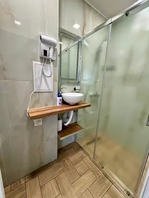a bathroom with a sink and a shower at Студио СВЕТИ ВЛАС 2 in Sveti Vlas