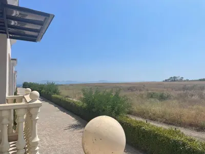 a porch of a house with a view of a field at Majestic Villas Pomorie Park in Sarafovo