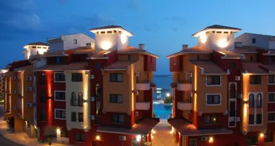 a row of houses with lights on them at night at Victoria's apartments -Marina Cape - Aheloy in Aheloy