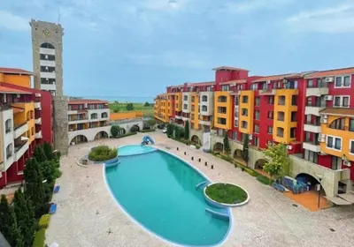 a large swimming pool in the middle of some buildings at Victoria's apartments -Marina Cape - Aheloy in Aheloy