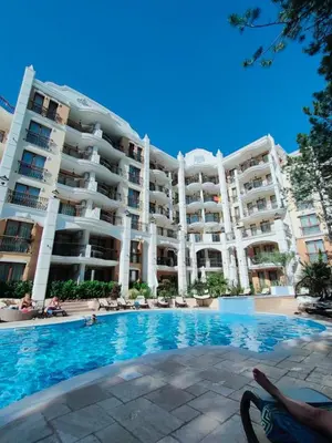 a large apartment building with a swimming pool at HARMONY SUITES Grand Resort PREMIUM Ferienwohnung in Sunny Beach