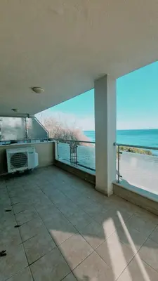 a large room with a view of the ocean at Апартаменти Бяла Бийч - Apartments Byala Beach in Byala