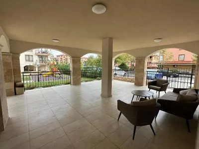 a lobby with a couch and chairs in a building at Sveti vlas apartament Sorrento Sole Mare V&D Luxury Style Apartment Свети-влас апартамент студио in Sveti Vlas