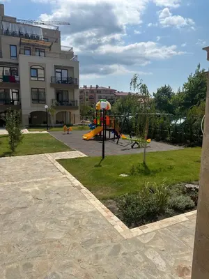 a playground in a park with a playground at Sveti vlas apartament Sorrento Sole Mare V&D Luxury Style Apartment Свети-влас апартамент студио in Sveti Vlas
