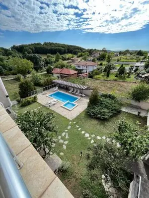an aerial view of a house with a swimming pool at Sunny house in Pismenovo